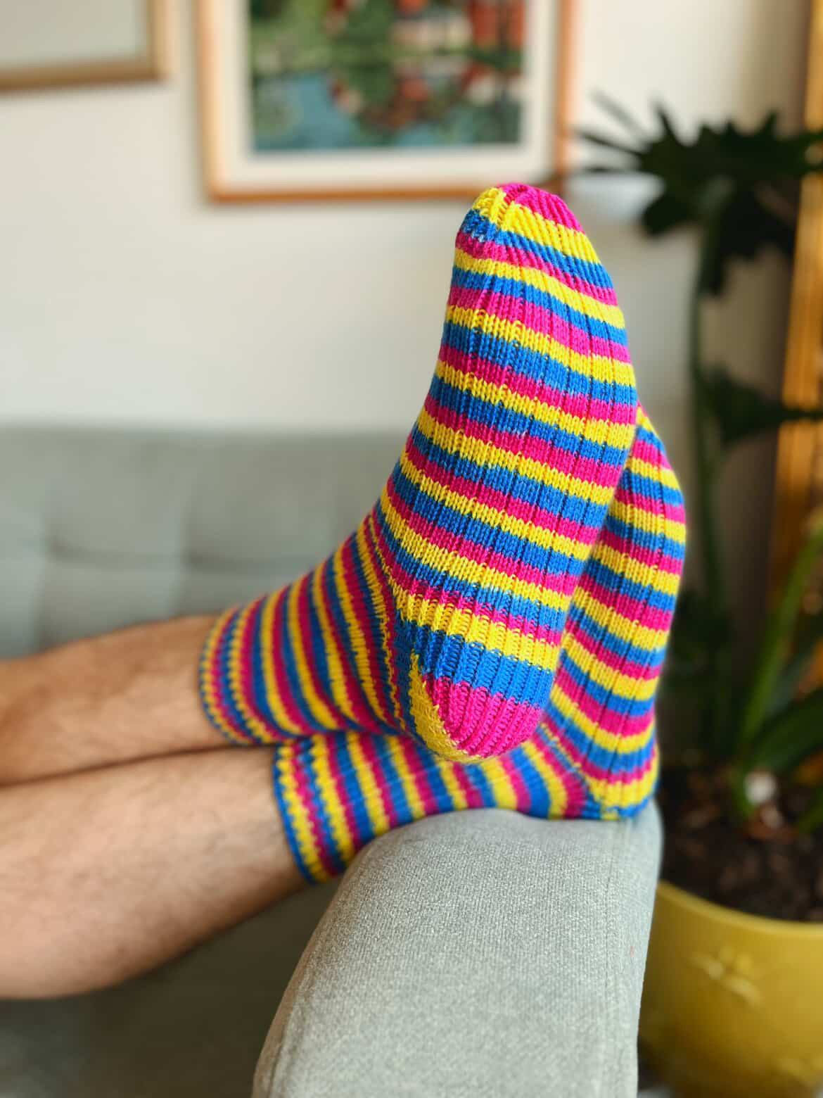 Striping Socks in Fandoms and Fibers Pansexual Pride Flag colorway. Pattern is the Capilano Socks by Kniteweup on Ravelry and Instagram 